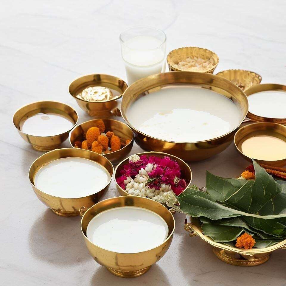 An assortment of traditional Hindu offerings for Rudrabhishek neatly organized in brass bowls.